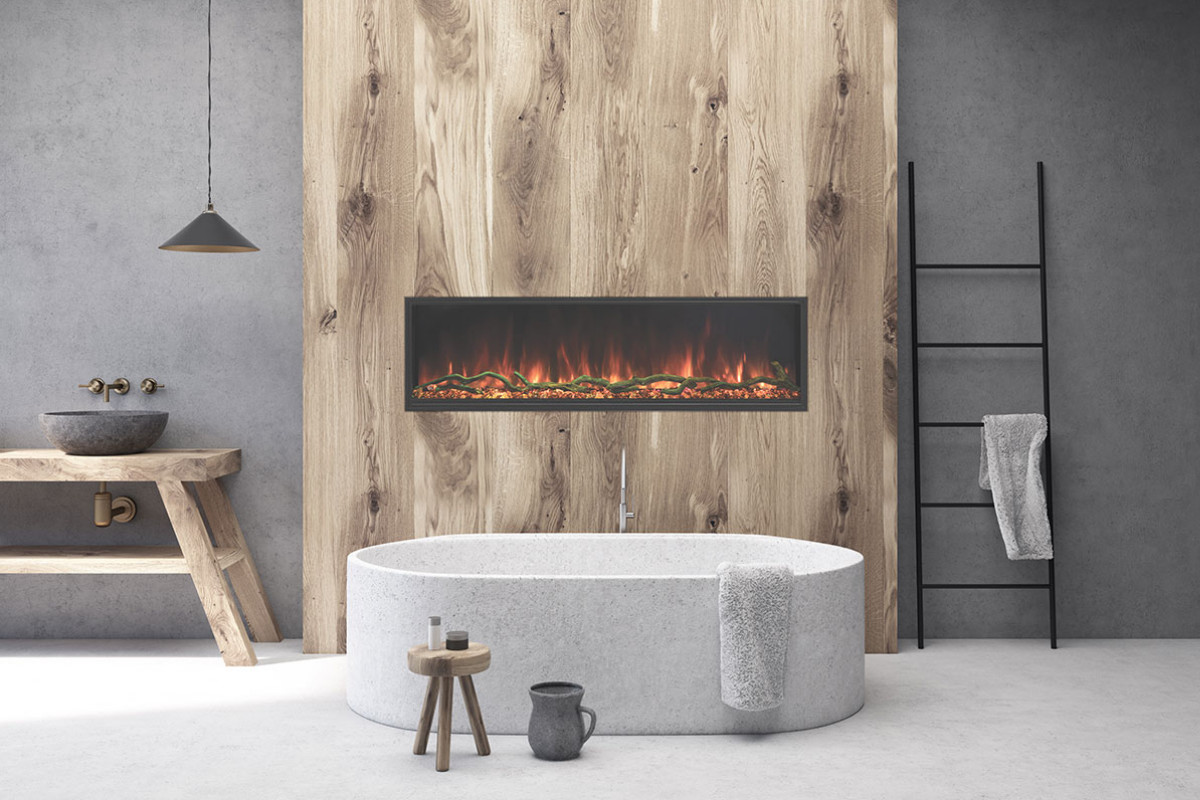 Modern bathroom interior featuring a freestanding oval bathtub, wooden vanity with a stone sink, and an electric fireplace set against a wood-paneled wall.