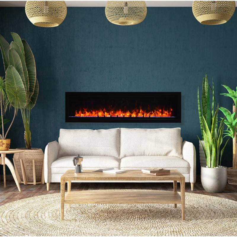Cozy living room with a modern electric fireplace, white sofa, wooden coffee table, and decorative plants against a teal wall.